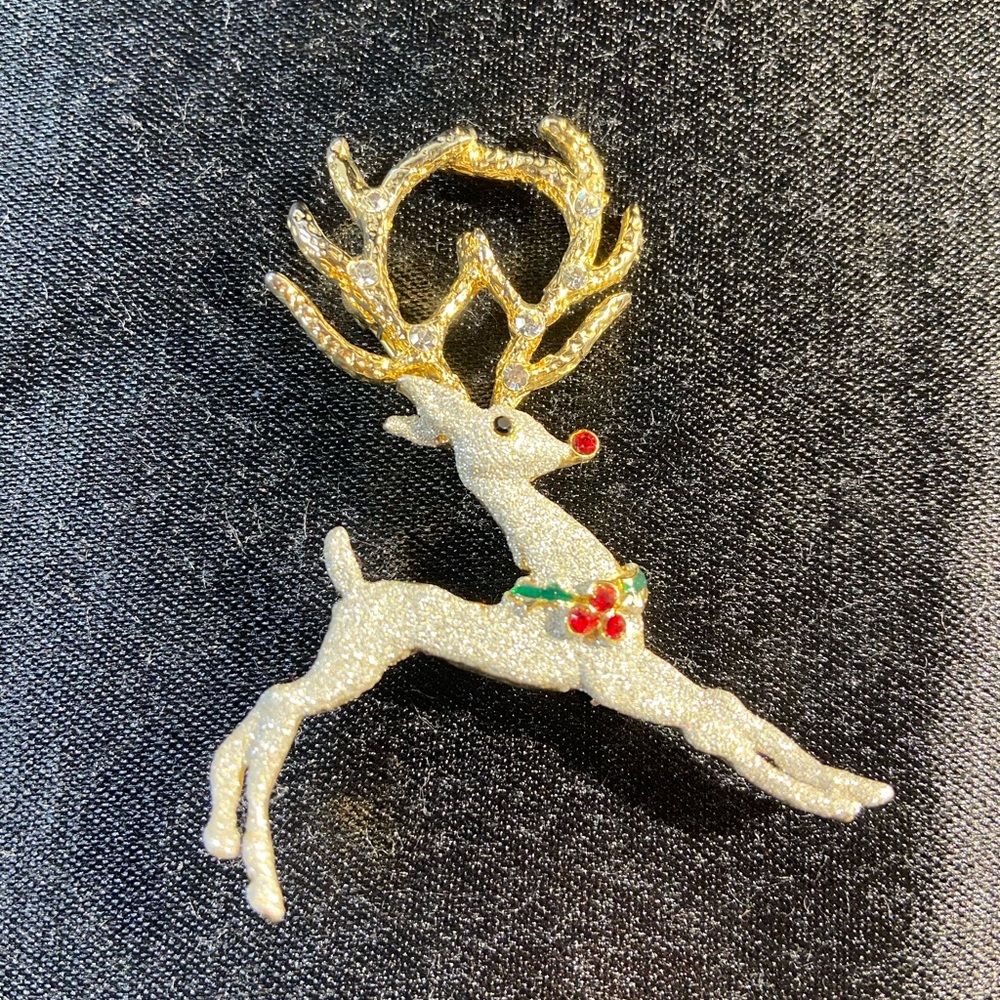 Leaping reindeer brooch pin. Gold and silver tone with sparkle and gems